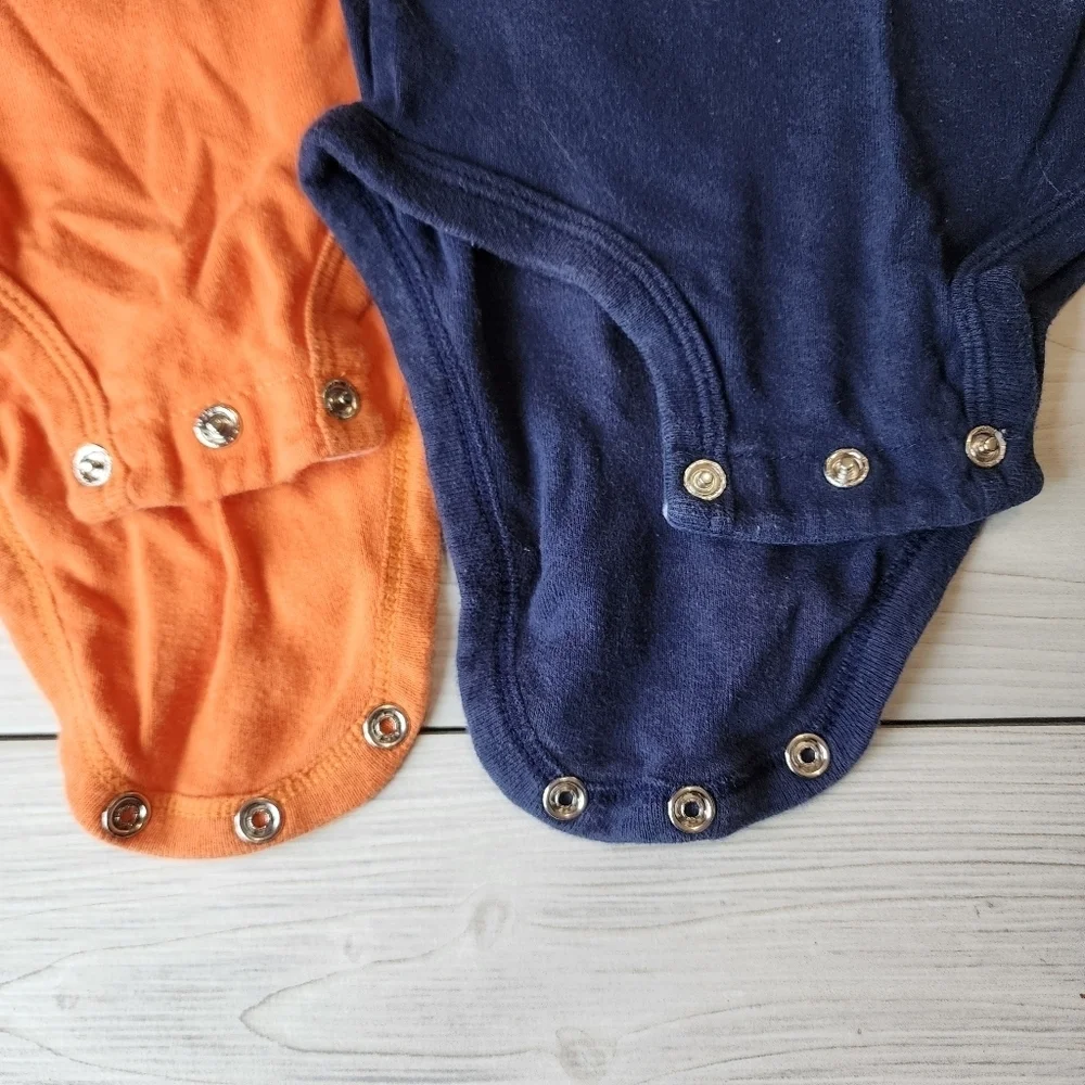 2 pack Carter's Football onesies size 12 mo